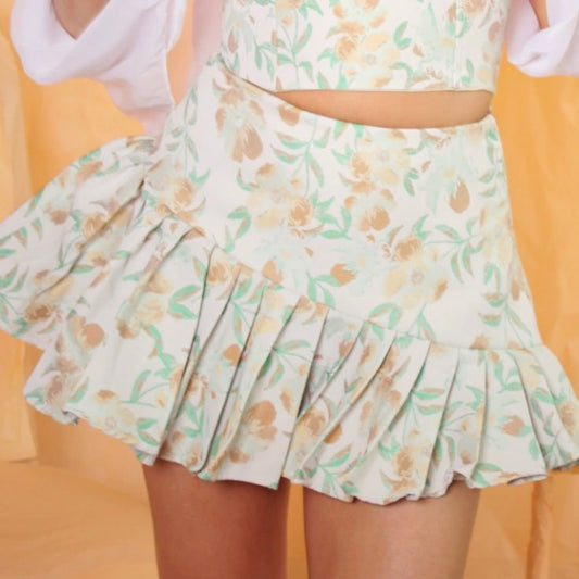 FALDA PLIEGUES FLORES VERDES